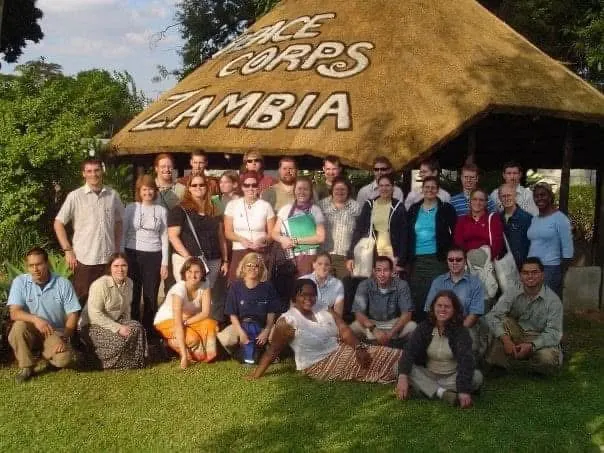 Natalie's 2005 Peace Corps Volunteer cohort gathered under the Peace Corps Zambia insaka