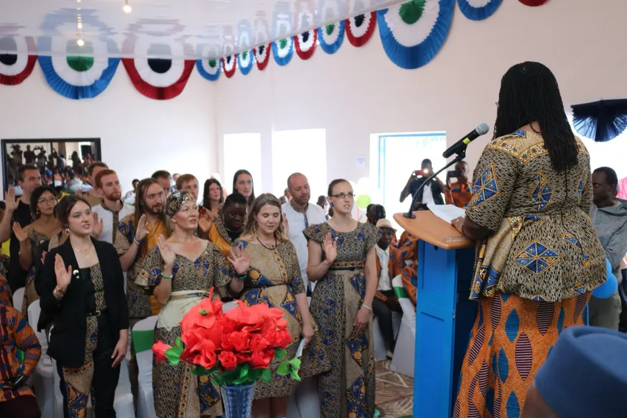 Natalie administering the Volunteer oath to a group of new Peace Corps Volunteers