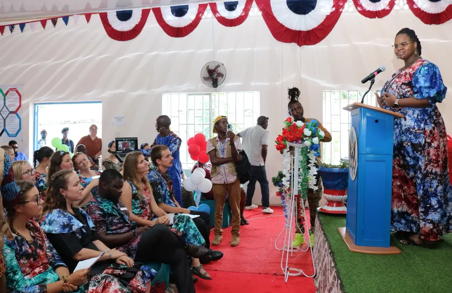 Natalie addressing newly sworn-in Volunteers from the podium at a ceremony